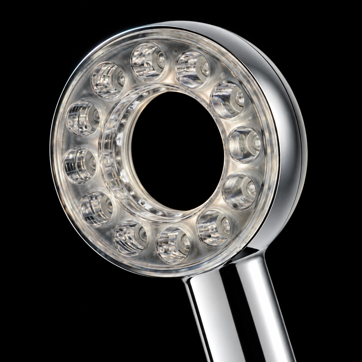 Angled LUX portrait: a silver chrome edge surrounding twelve recessed nozzles and a clear open centre